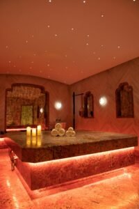 Exquisite Turkish bath in Delhi with warm lighting, towels, and candles.